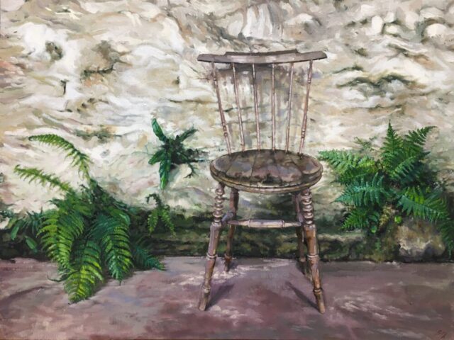 Old kitchen chair with ferns